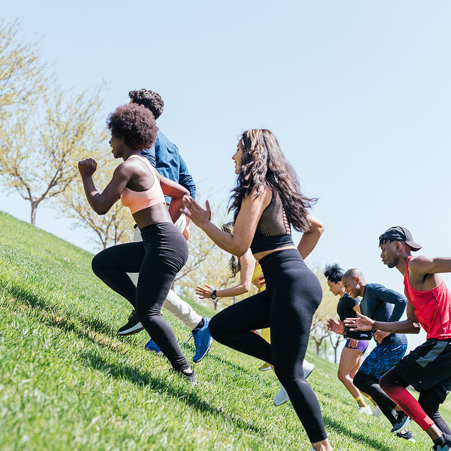 group-of-runners-running-up-a-hill-horizontal